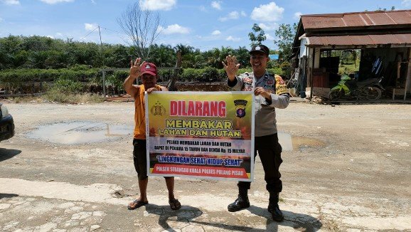Polsek Sebangau Kuala Mensosialisasikan Himbauan Melarang Membakar Hutan atau lahan
